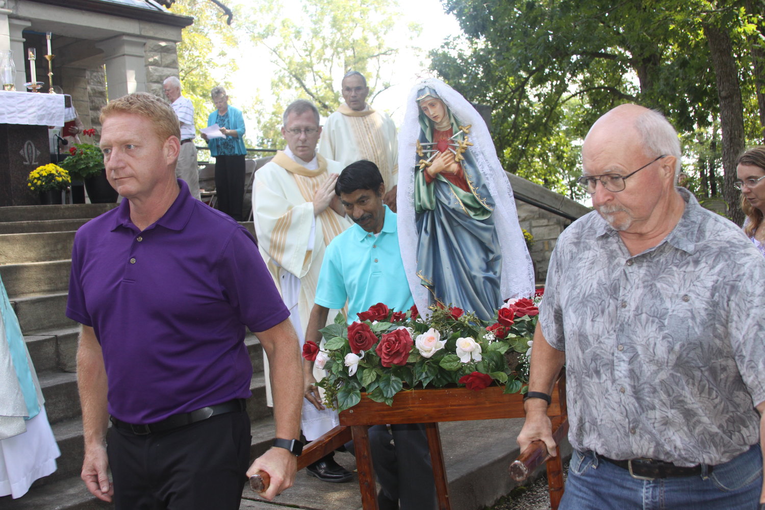 The statue of the White Lady is carried back to the small chapel following the Fall Pilgrimage Mass on Sept. 11 at the Shrine of Our Lady of Sorrows. The chapel was built in 1888 for the protection of the White Lady, but a few years later, it was enlarged to its present size.